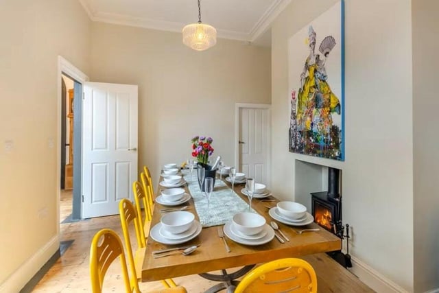 The dining room has double doors to the yard garden, as well as access to the kitchen.