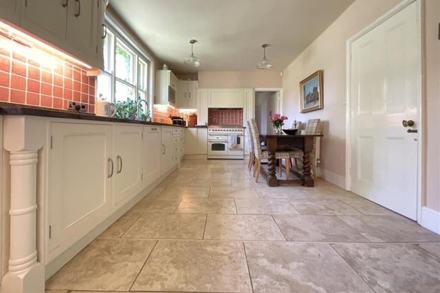 An extensive, bright dining kitchen has a full range of fitted units.