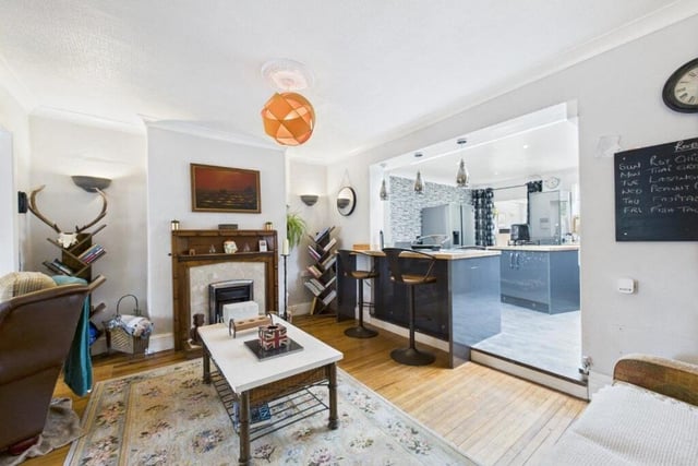 The open plan design links kitchen and lounge.