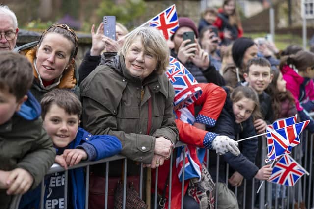 Members of the public wait for King Charles III and the Queen Consort during their visit to Talbot Yard Food Court in Yorkersgate, Malton, North Yorkshire, where they met food and drink producers with shops to hear about their locally produced goods. James Glossop/PA Wire