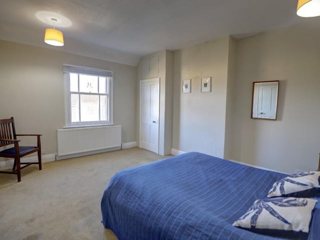 Another double bedroom in the property displays the space available.