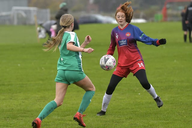 Scarborough Ladies Under-15s' Sarah Dicks looks to close down a Wigginton player