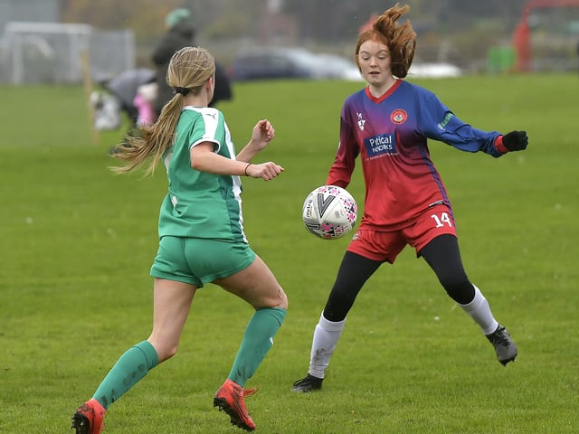 Scarborough Ladies Under-15s' Sarah Dicks looks to close down a Wigginton player