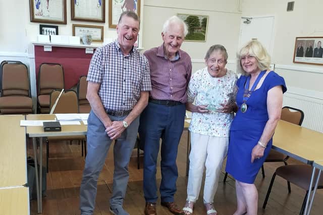 Mrs Plevey receiving her trophy from Cllr Jeffels, watched by Cllr Linda Wallis, chair of Seamer parish council and Cllr Peter Morrell, chairman of Irton parish council.