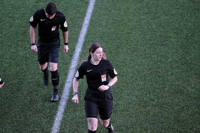 Match officials exit the Flamingo Land Stadium pitch at the start of the second-half suspension.