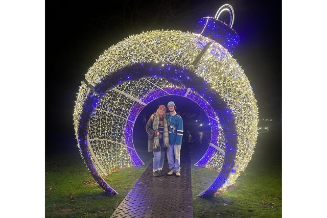 Claudia and Henry are pictured here in a spectacular giant bauble.
