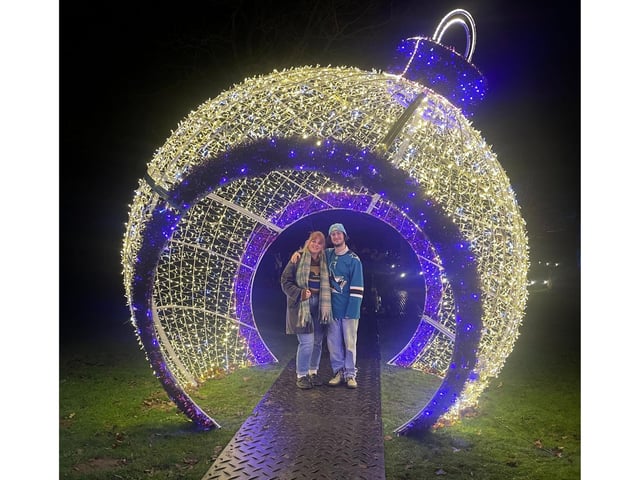 Claudia and Henry are pictured here in a spectacular giant bauble.