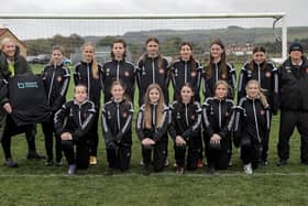 Beyond Housing Community Connector Coordinator Stephanie Lake (left) presents the new Beyond Housing sponsored strip to the Scarborough Ladies U14 team, with their Manager Colin Hepples (right).