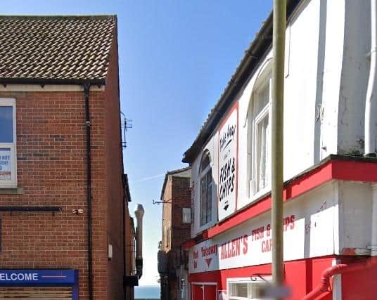 The pathway between Allen’s Nosh Bar and JC’s Restaurant. Image courtesy of Richard M Jones