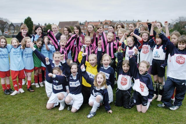 Bramcote School hosts a football tournament for Year 3/4 girls from local junior schools. The semi-finalists line up for a group picture along with the marshalls from Graham School.