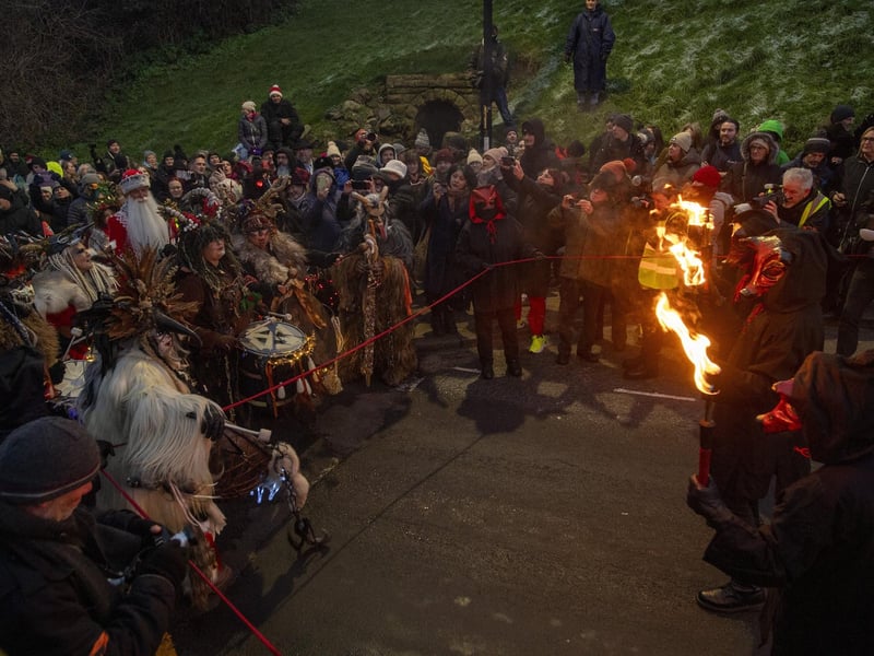 Crowds watch the Krampus Run on Khyber Pass.