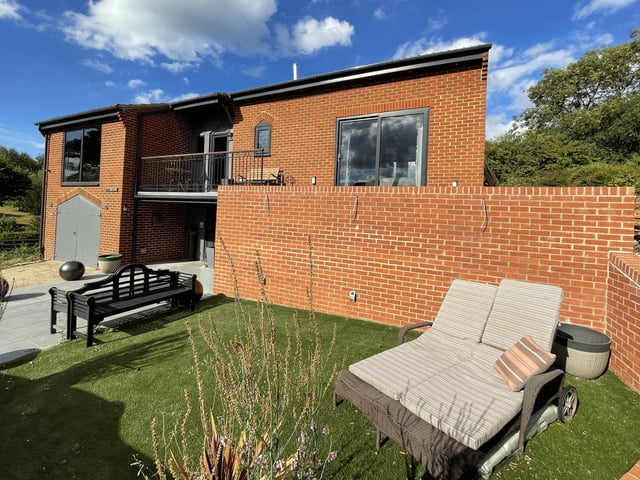 A lawned garden area to the front of the property.