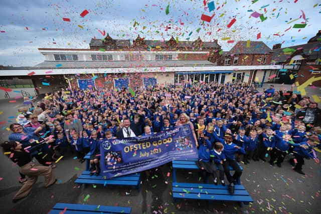 Gladstone Road celebrate a good Ofsted inspection, headteacher Garry Johnson with staff and pupils.