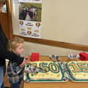 Egton School's 150th cake was cut by James (year six) and Parker (reception), the oldest and the youngest pupils in the school.