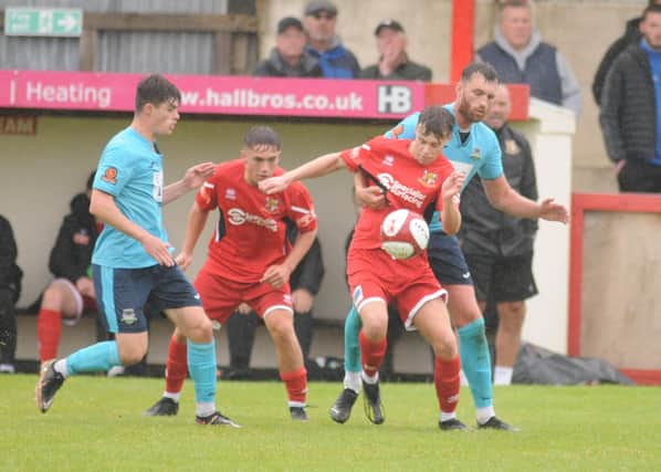 Local youngsters Billy Ripley, left and Coby Scotter, on the ball, impressed as subs against Farsley. PHOTOS BY DOM TAYLOR