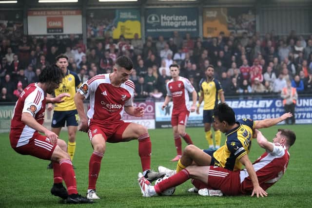 The hosts get stuck in against Scunthorpe United.