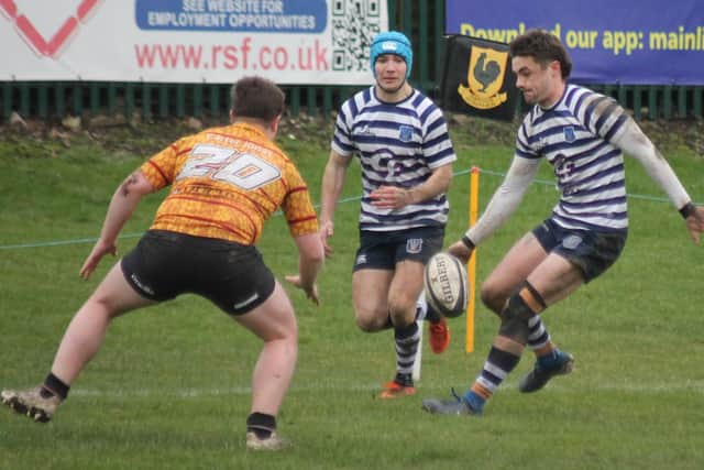 Rob Boddy kicks ahead for Sam May (blue headgear) to score. Photo by Phil Gilbank