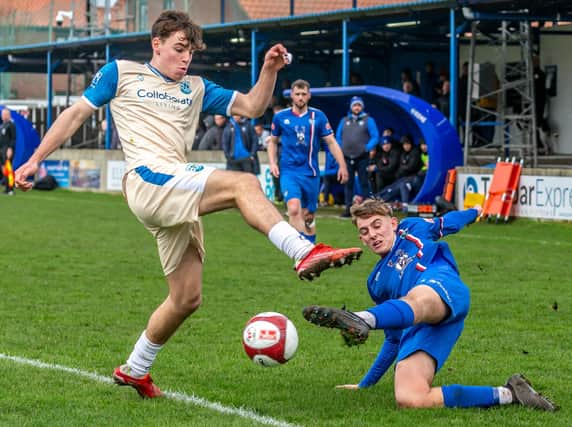 Aaron Braithwaite slides in for Whitby Town during the goalless draw at home to Radcliffe. PHOTO BY BRIAN MURFIELD