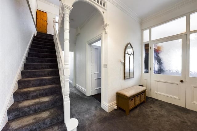 Hallway and stairs, with an archway feature.