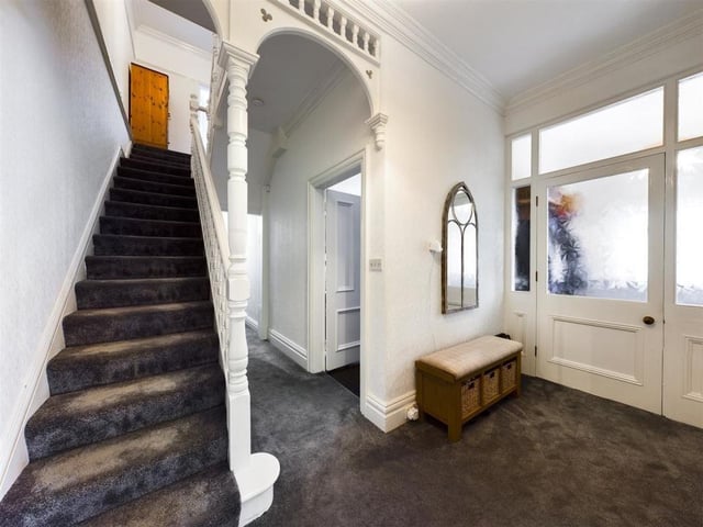 Hallway and stairs, with an archway feature.