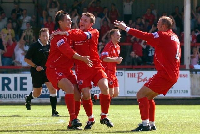 Do you recognise any of the Scarborough FC players celebrating a goal against Woking in the season opener at the McCain Stadium on August 14 in 2004?