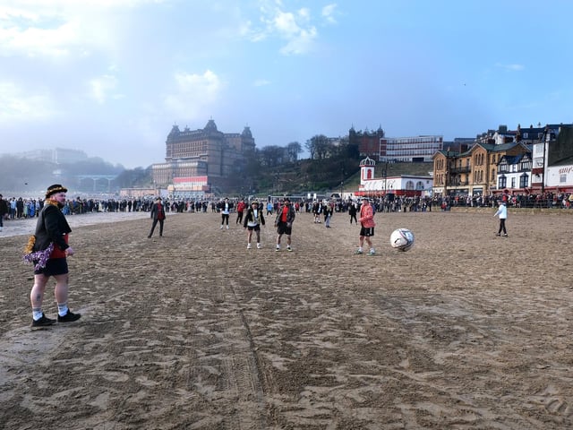 Crowds line the pitch