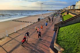 Phill Taylor leads the way along the seafront at the New Year's Day Bridlington Parkrun PHOTO BY JOHN EDWARDS