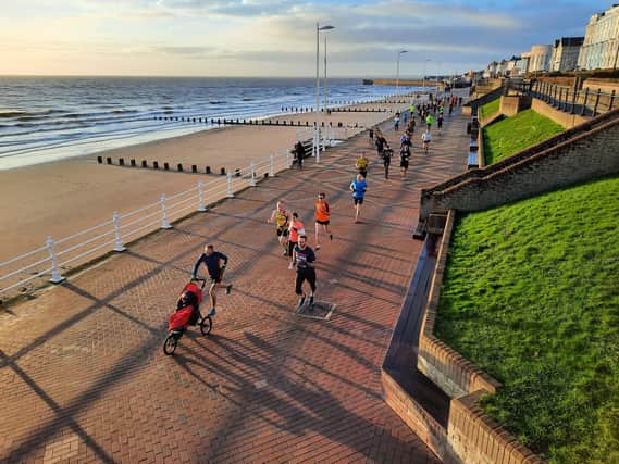 Phill Taylor leads the way along the seafront at the New Year's Day Bridlington Parkrun PHOTO BY JOHN EDWARDS