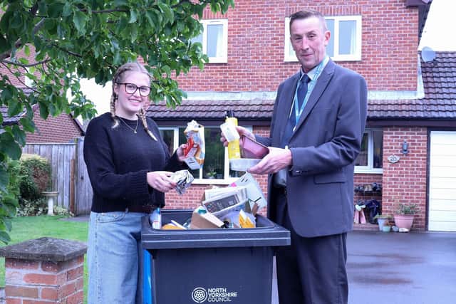 Cllr Richard Foster with North Yorkshire resident, Alexis Flint, demonstrating what can be recycled.