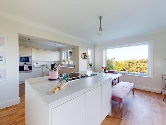 Large picture windows bring in plenty of natural light to the open plan arrangement.