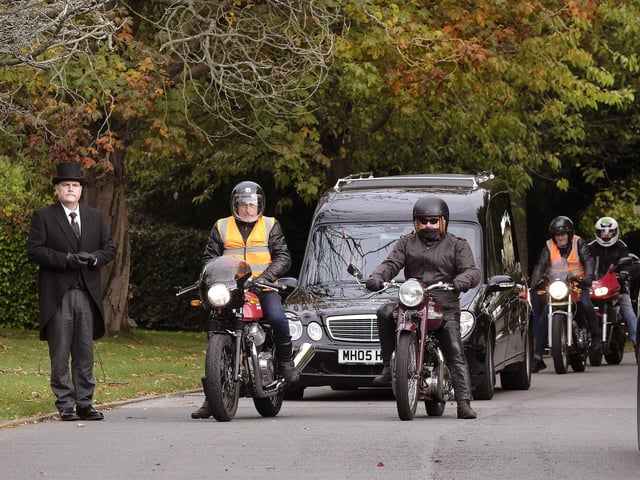 The cortege wait to enter the crematorium