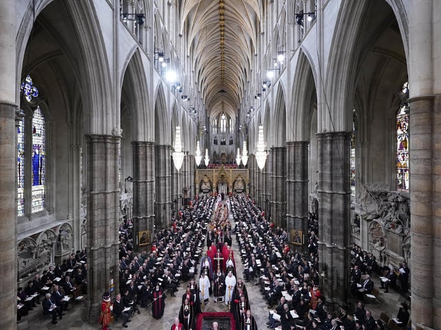 Members of the clergy wait for the coffin of Queen Elizabeth II to arrive at Westminster Abbey ahead of the state funeral. (Photo by Danny Lawson - WPA Pool/Getty Images)
