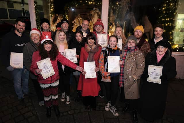 Christmas window winners presentation outside the Boyes Store with Janet Jefferson