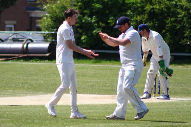 Flamborough CC celebrate taking a wicket at Cayton 2nds