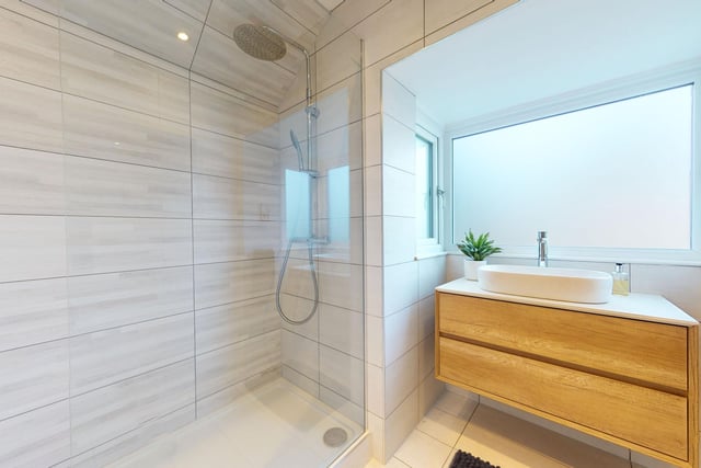 A walk-in double shower is a feature of this modern facility.