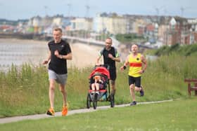 Phill Taylor, of Bridlington Road Runners, secured ninth place while pushing a buggy at the Sewerby Parkrun on Saturday morning. PHOTOS BY TCF PHOTOGRAPHY