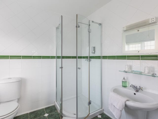 A shower room within the five to six bedroom property.