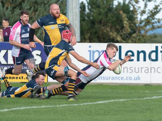 Euan Govier goes over for a try in the 24-5 win for Scarborough.