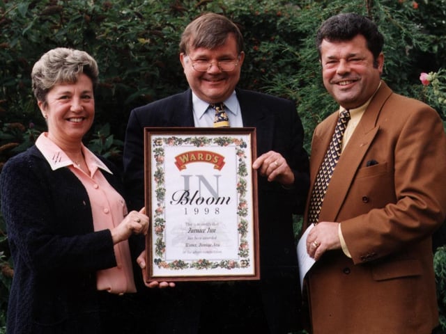 Mile Ridyard, centre, business development manager at Ward's Brewery, congratulates the winners of the Wards in Bloom competition. Geoff and Linda Cooke from the Furnace Inn, Hoyland, Barnsley won the Best Frontage category.