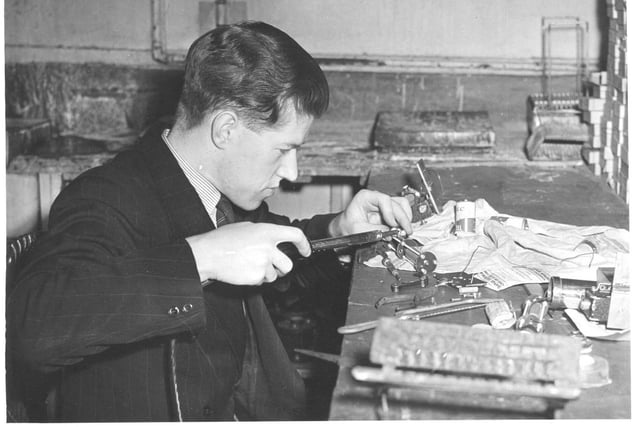 Dennis Raper working on his electronics hobby in the 1940s.