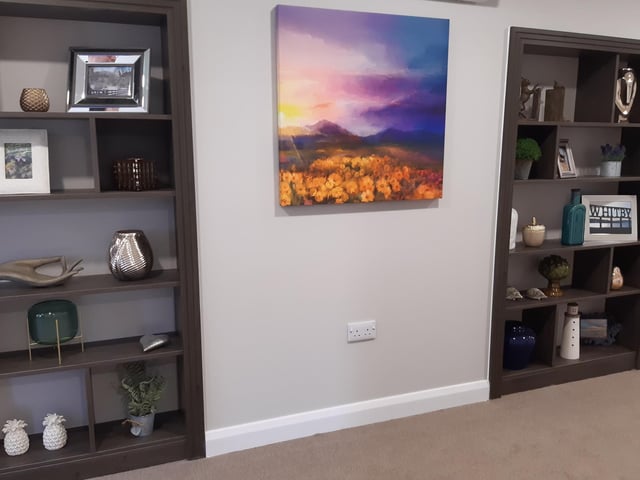 Artwork and photos on the top floor.