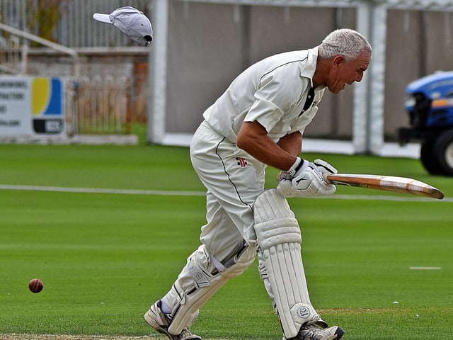 Pickering batter Colin Frank loses his cap.