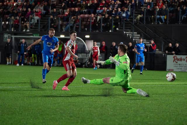 Scarborough Athletic's Dom Tear puts the hosts 2-0 ahead in the first half of the 5-2 home win against Dunston in the FA Cup second qualifying round replay on Tuesday. PHOTOS BY WANDERING PHOTOGRAPHY