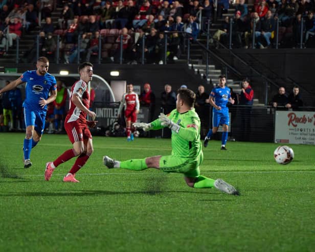 Scarborough Athletic's Dom Tear puts the hosts 2-0 ahead in the first half of the 5-2 home win against Dunston in the FA Cup second qualifying round replay on Tuesday. PHOTOS BY WANDERING PHOTOGRAPHY
