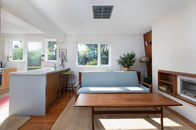 Open living space, with an original electric fire.