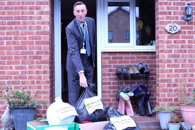 North Yorkshire Council’s executive member for managing our environment, Cllr Richard Foster, with pre-loved clothes and small household items to be picked up by Anglo Doorstep Collections.