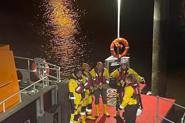 Volunteers with Whitby RNLI interrupted their festive family celebrations after the boat team's youngest member, Andy Brighton, spotted a flare as he was walking along Church Street in the seaside town.