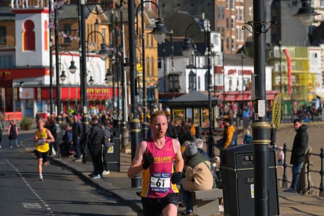 Scarborough 10K winner Adam Theaker, of Loftus & Whitby AC, races the the finish line pic Richard Ponter