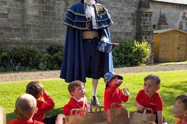 1st Filey Squirrels listen to the town’s crier