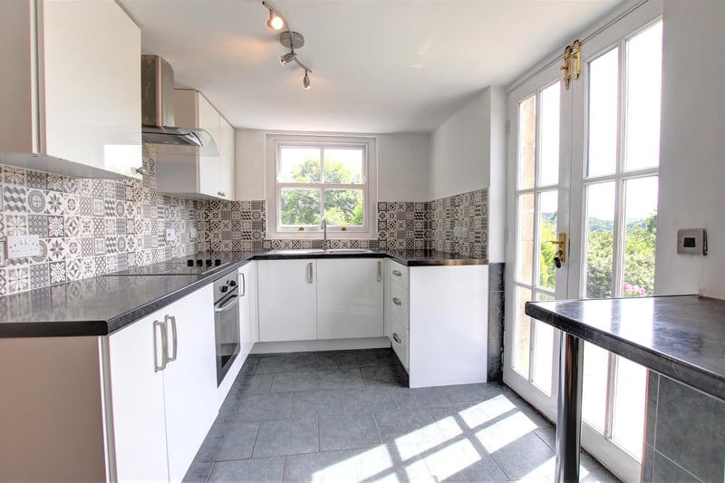 The modern fitted kitchen within the lower ground floor apartment.